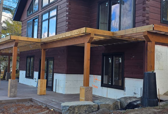 Front angle view of timber porch and stained exterior