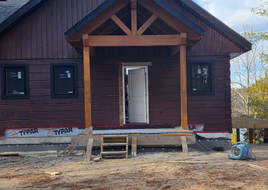 Front entry gable on restored log home