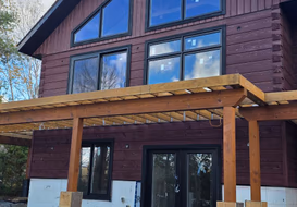 Freshly stained front elevation with timber porch