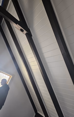 Close-up view of restored interior beam joinery