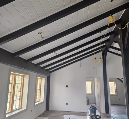 Bright open-concept interior after log home restoration